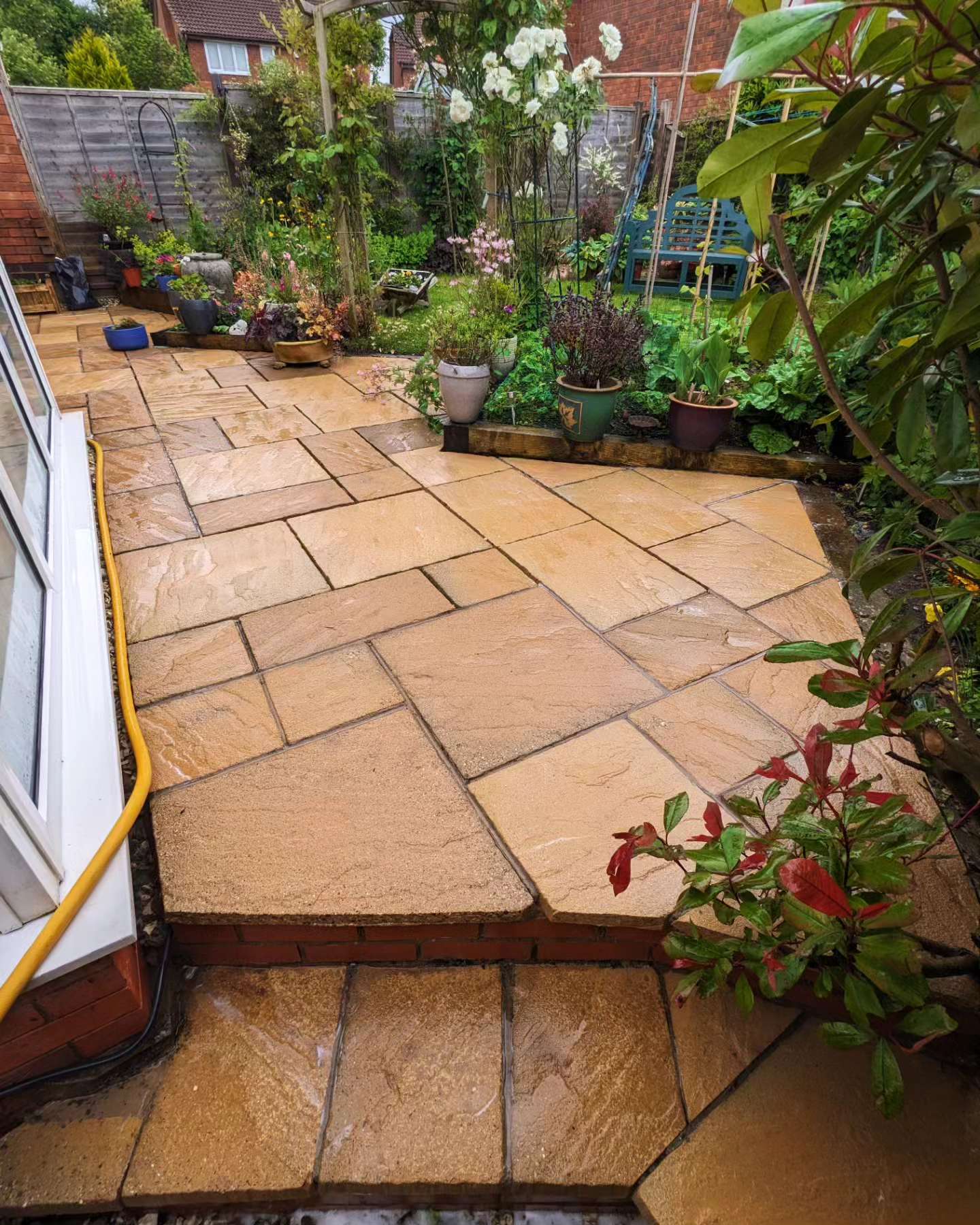 Sandstone patio cleaned and restored with jet washing