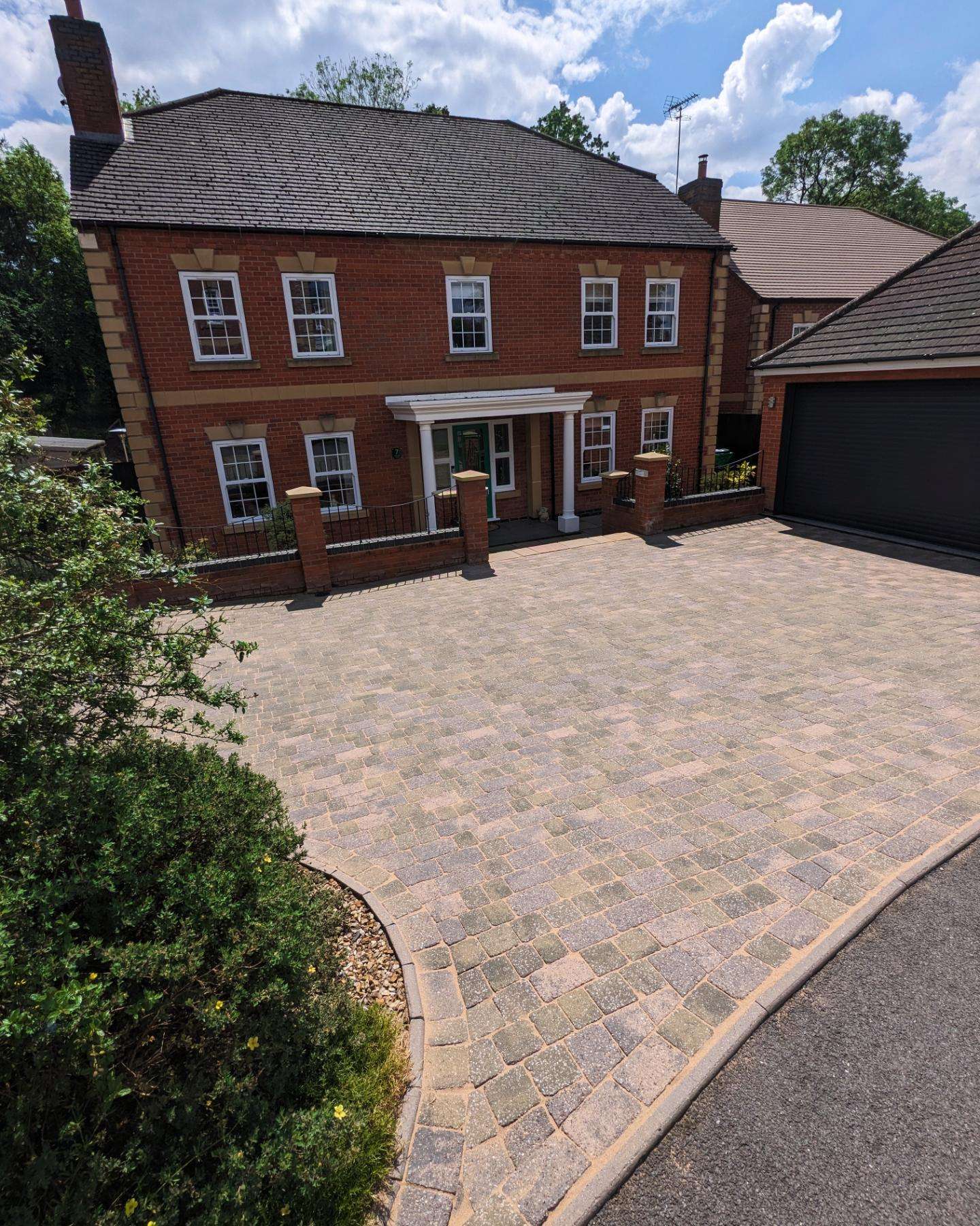 Beautiful clean block paving driveway after professional jet washing