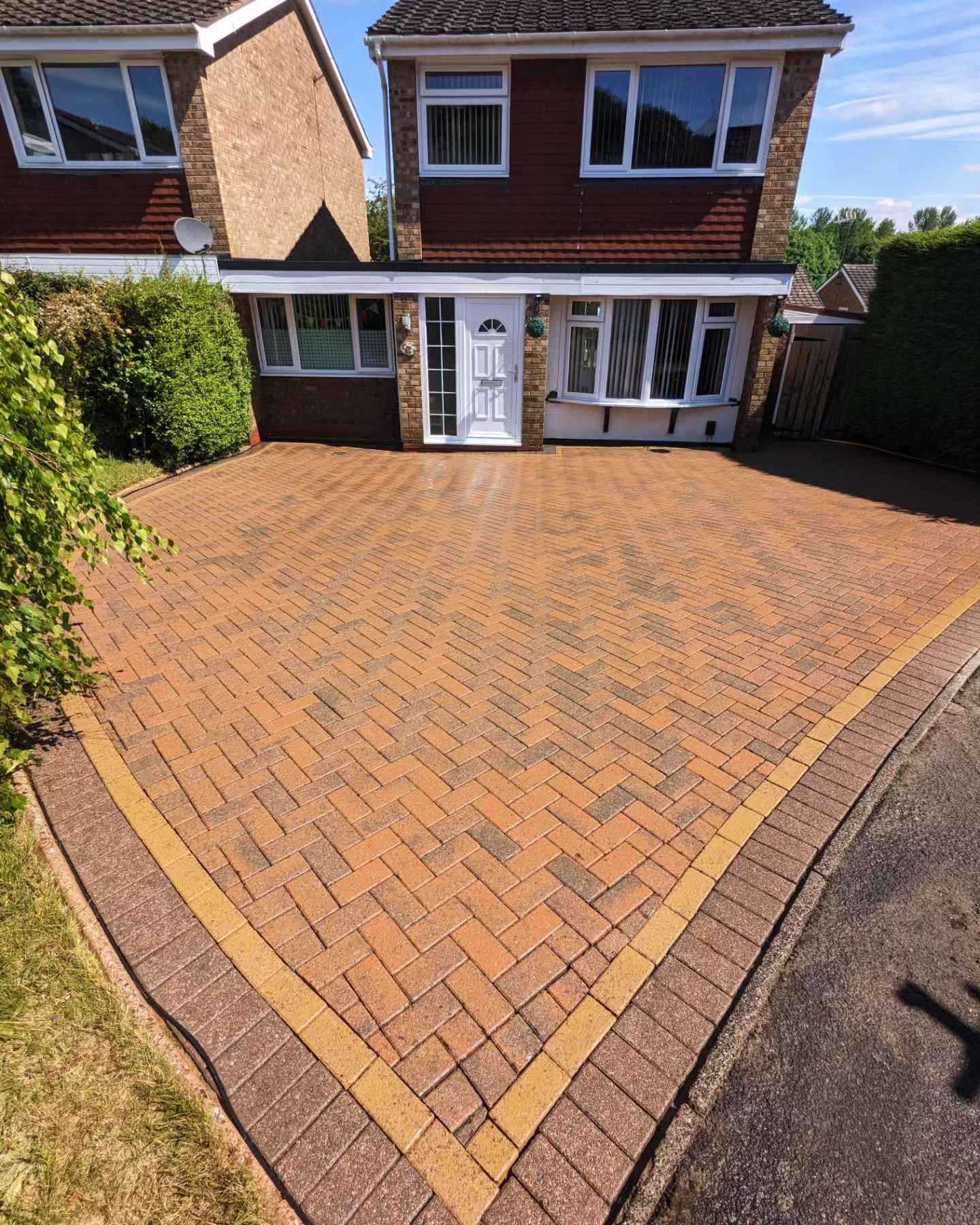 Beautiful clean block paving driveway after professional jet washing